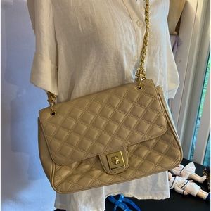 A beautiful, gold, iridescent Balenie bag that's classy for all